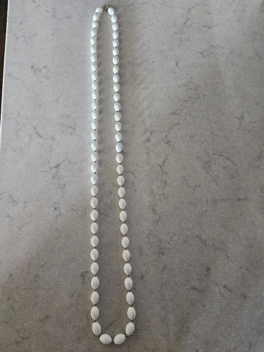 RARE AND VINTAGE WHITE RIBBED OVAL BEAD 48